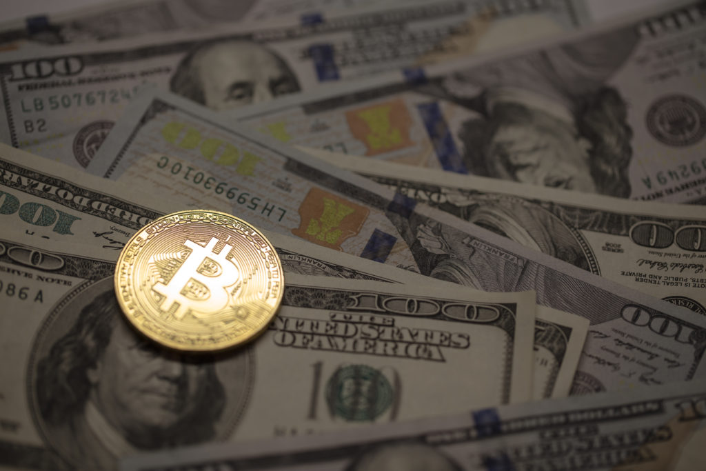Image featuring dollar bills and a Bitcoin coin symbolizing financial assets in the context of Bitcoin and Divorce