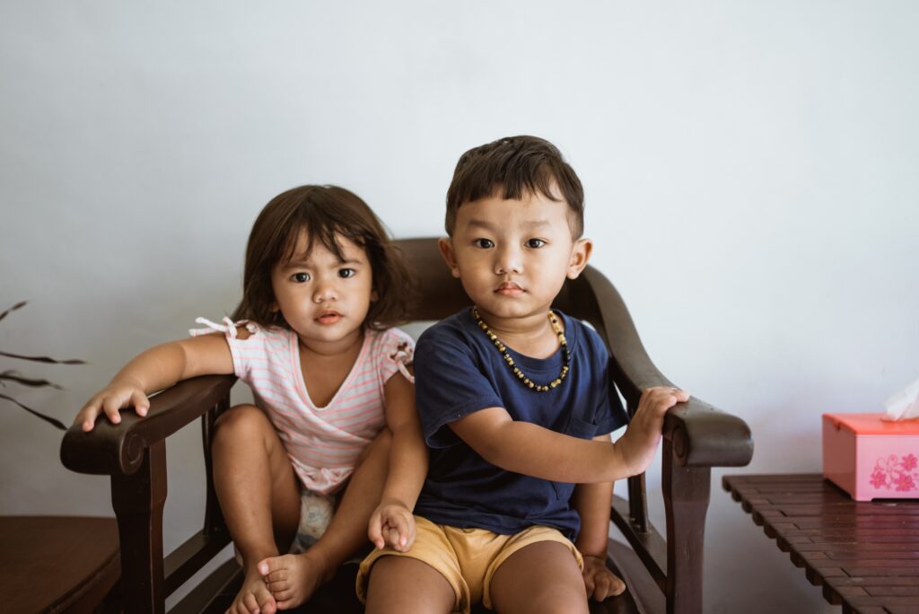 Two young kids participate in the child interview process for a parenting time evaluation.